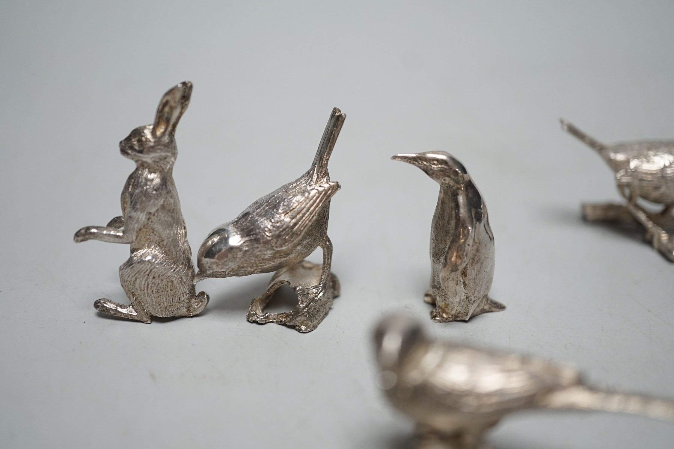 A small collection of seven 1980's/1990's miniature silver models, by Paul Eaton, comprising five birds, a rabbit and a penguin, tallest 43mm.